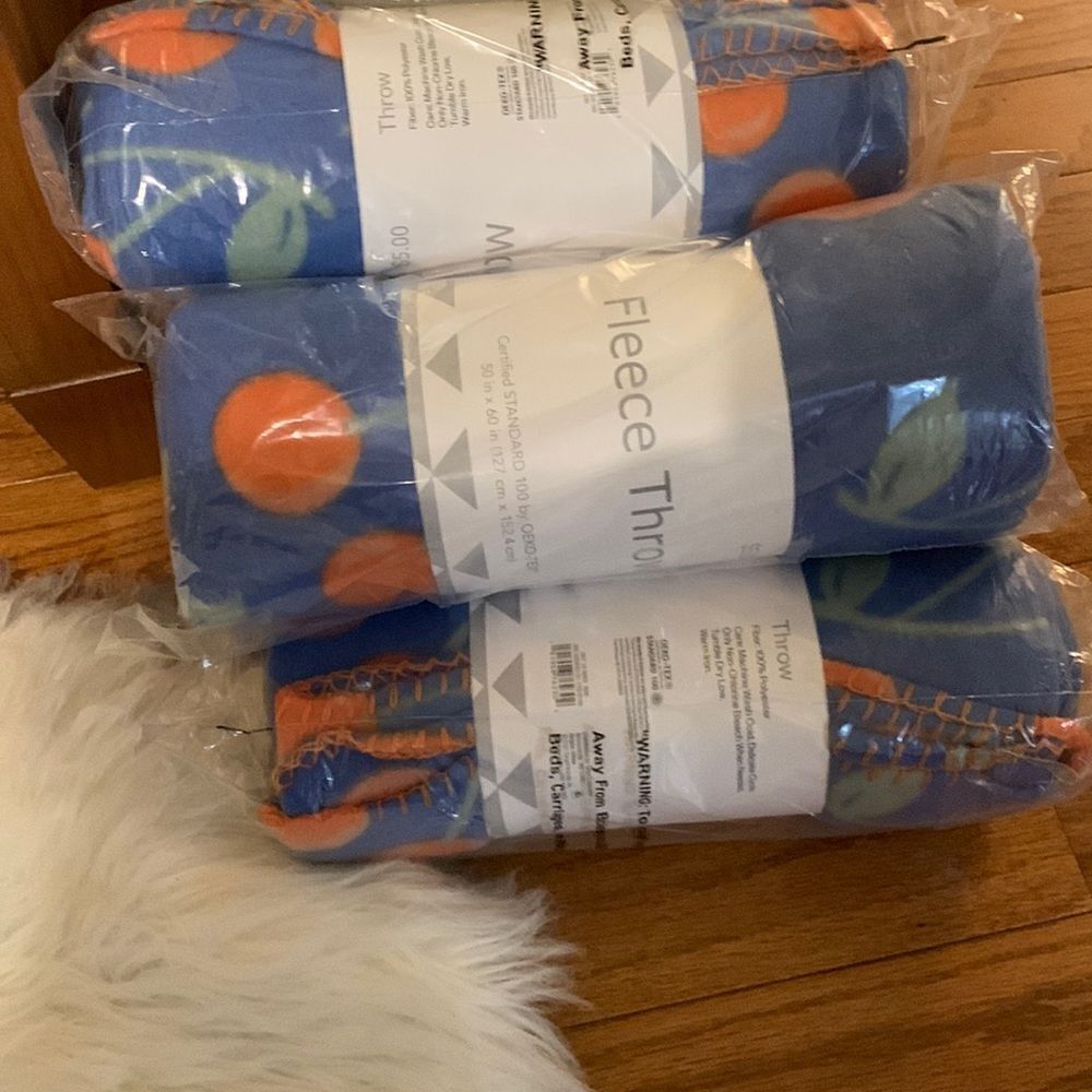 Bundle of five blue fleece throws. 50" x 60"